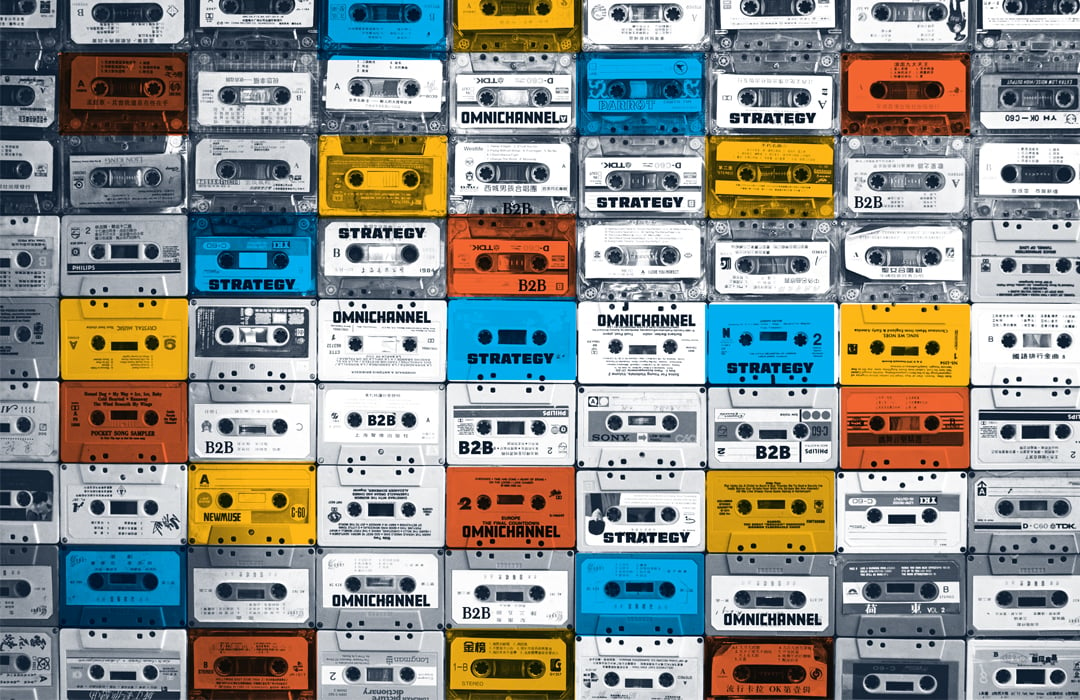 A wall of colorful vintage tape decks featuring the words B2B and omnichannel strategy